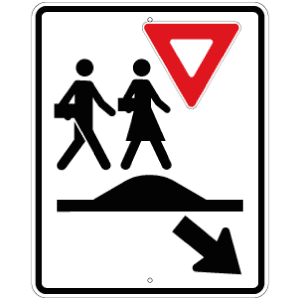 Passage pour écoliers sur un dos d'âne allongé ou un carrefour surélevé